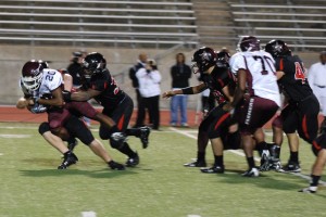 A tackle on lewisville's quarterback at the last home game of the 2009 season. Photo by Tyler Morris.