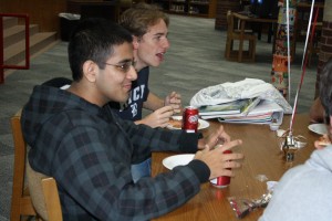 Seniors Bharad Raghavan and Henry Trahan enjoy pizza and salad at the luncheon