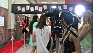 Photographers and reporters prepare for filmmakers and sponsors to walk the red carpet at the CHS Film Festival on Monday evening. Photo by Regan Sullivan.