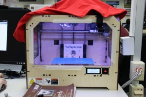 The engineering department received this MakerBot Replicator 1 3D printer from its booster club last year. Students use this printer for both projects and engineering competitions. Photo by Sandy Iyer.