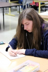 On Tuesday, freshman Kristin Boyer works on a portrait piece of her sister in Elsa Reynolds Art class. Boyer was chosen as one of the State Youth Art Month winners by the Texas Art Education Association. Photo by Alyssa Frost.