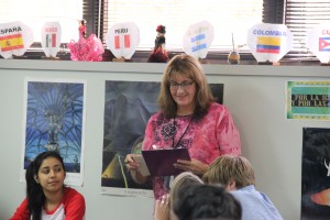 Whiting corrects a students paper as she teaches her students about spanish verbs. Photo by Nicole Messer.