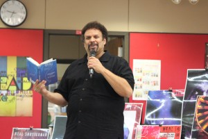 Author Neal Shusterman reads a paragraph of his new release "Challenge Deep" to describe his creative process to students. Photo by Kelly Monaghan.