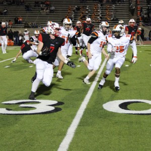 Coppell High School junior running back Joe Fex runs the ball on offense across Buddy Echols Field. Coppell defeated Haltom Friday night 44-6. Photo by Megan Winkle