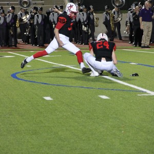 Coppell High School senior kicker Tyler Smith kicks a field goal as the first quarter comes to a close extending the score to 38-6. The Cowboys beat the Buffalos 44-6 Friday night at Buddy Echols Field. Photo by Megan Winkle