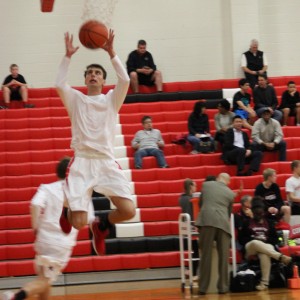 Coppell High School senior guard K.J. Luenser warms up his jump shot before the game against Mansfield Timberview. The Cowboys beat the Wolves Friday at home in the large gym 54-52.