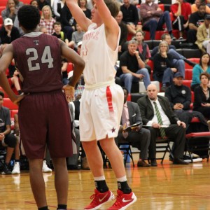 Coppell High School junior forward Sam Marshall shoots a free throw during the home game Friday night. The Cowboys beat the Wolves 54-52.