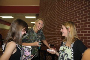 New associate principal Leanne Dorhout mingles with seniors Sarah Thomas and Grace Kennedy (left to right), before school.