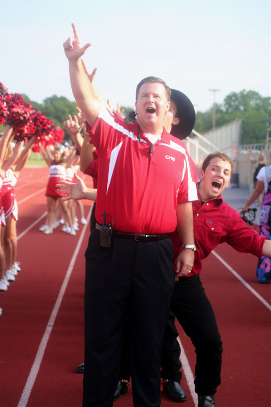 Principal Brad Hunt and senior Jake McCready cheer at the Aug. 28 pep rally.