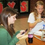 Students are now allowed to use their cell phones during lunches and passing periods and many students are taking advantage of the new rule. Photo by Kelly Emerson.