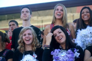 Seniors enjoy the homecoming pep rally from the stands. 