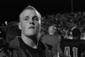  Senior Taylor Townley watches the Coppell v. Hebron football game from the sideline. Townley's football career was recently ended due to an accident and injuries.
