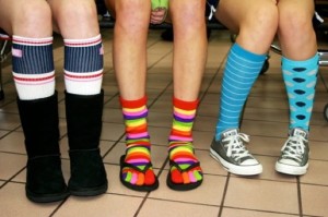 Seniors Shelby Samuels, Rebekah Henderson and Audrey Bauer participate in Red Ribbon Week by wearing crazy socks. (Photo by Katie Quill)