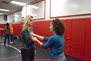 Seniors Shelby Jurca and Mallory Osigian practice defensive movements. Photo by Elizabeth Sims.