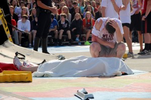 Senior Austin Gardner kneels by the deceased body - senior Cassidy Pickrell. Photo by 