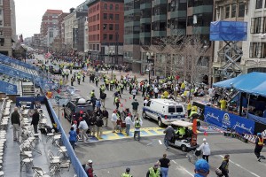 Emergency personnel assist the victims at the scene of a bomb blast during the Boston Marathon in Boston, Massachusetts, Monday, April 15, 2013. (Stuart Cahill/Boston Herald/MCT)