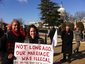 Kris White, 32, and Lyssa White, 29, of Manassas, Virginia, say they've been married for five years, and carried a poster referring to a 1967 Supreme Court case that overturned state laws banning inter-racial marriages, in Washington, D.C., on Tuesday, March 26, 2013. The couple joined demonstrators in urging the current Supreme Court to rule in favor of gay marriage. (Curtis Tate/MCT)