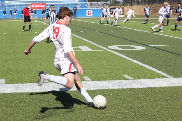Junior Chis Madden crosses the ball in hopes of getting it to another teammate in Friday's 2-0 victory over Kingwood in Georgetown during the Class 5A semifinal match. Coppell faces Brownsvile Hanna at 6 p.m. Saturday for the Class 5A championship. Photo by Davis DeLoach.