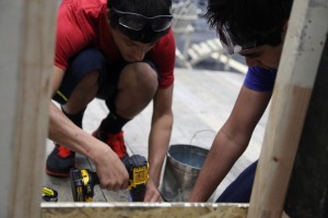 Sophomores Devin Wilson and Vipul Reddy work on a beach house for the set of "Gillian on her 37th birthday" during technical theater. Photo by Rowan Khazendar.