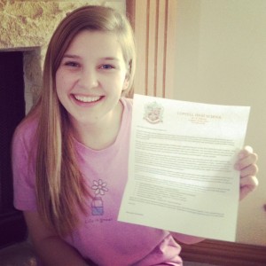 Junior Lilly Balsamo holds up her Red Jackets acceptance letter. The next class of Red Jackets will consist of 33 students. Photo courtesy Lilly Balsamo. 