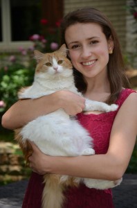 Design Editor Jordan Bickham poses with her cat Bella.