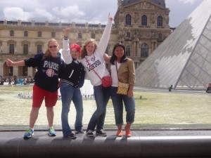(From right to left) Sophomores Aisha Espinosa and Sierra Latshaw pose with other Girl Scouts in front of the Louvre during their two week trip to Europe. 