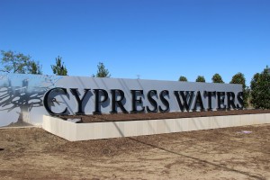 A slick and modern entrance welcomes residents to Cypress Waters, located off of Beltline Road and E. Saintsbury Street. The development will be home to the new Lee Elementary School. Photo By Mark Slette. 
