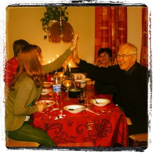 Me and my grandfather recreating our high five with my grandma looking on from the back during our Christmas feast on Christmas Even in 2010 at my grandparents' home in Oulu, Finland. 