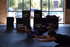 Crossfit Coppell Central trainer Pamela Vas demonstrates proper form during a the 5 p.m. class. Photo by Sandy Iyer.