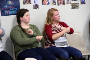 Seniors Kayla Smith and Olivia Brooks practice key weather terms in Dawn Clyburn's ASL (American sign language) class  on Tuesday. Photo by Alyssa Frost. 