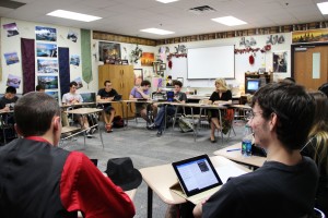 Coppell High School Academic Decathlon students take time to read and analyze the lyrics to the song “Stay Down Here Where You Belong” by Irving Berlin Thursday during fourth period in H136. Photo by Nicole Messer.