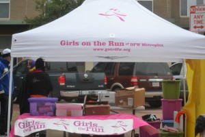The Girl on the Run organization set up a tent at the 5K to sell T-shirts and headbands and raise awareness about their mission. Photo by Elizabeth Sims.