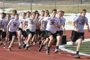 On Thursday Dec. 12, the varsity football players went on the track for sprints after lifting and stretching in the field house. Photo by Alyssa Frost. 