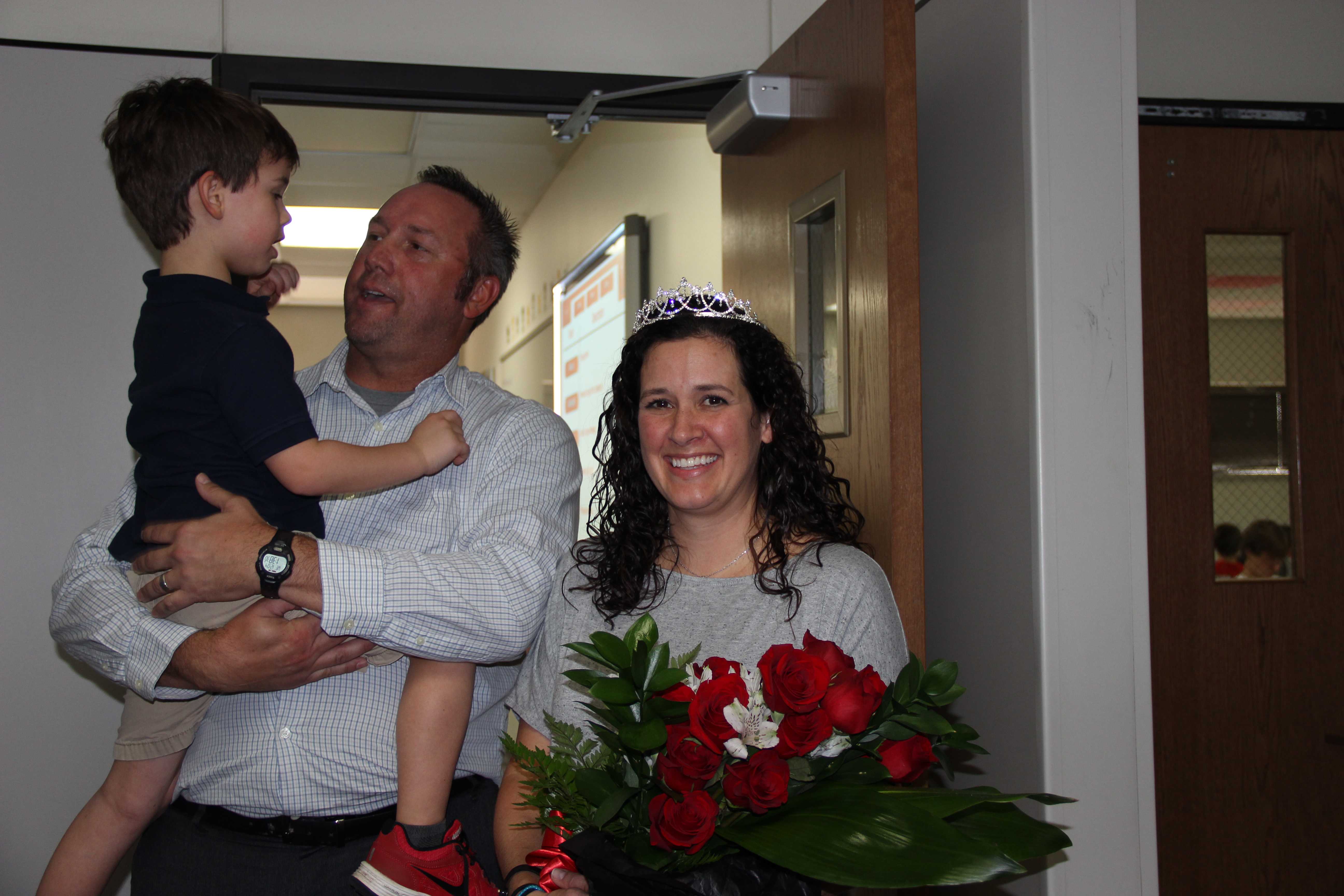 Anatomy and Physiology teacher Jodie Deinhammer, pictured with her husband and son, was named 2013-2014 Coppell High School Teacher of the Year on Wednesday during fifth period.  Photo by Jena Seidemann