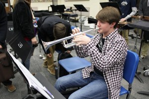 Coppell High School sophomore trumpet Christopher Stubblefield practices All State music Friday after school in the band hall. Stubblefield made the All State band after making area for the second year. Photo by Nicole Messer.