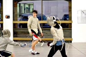 Junior Derek Weix referees a match between two of his classmates. Photo by Elizabeth Sims.