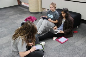 Junior students prepare for a group presentation by looking over presentation notes. Photo by Shannon Wilkinson.