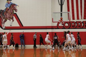 Late in the third quarter, Coppell senior point guard Landon Goesling hits a crucial three pointer to pull the Cowboys ahead 42-39 over the Lewisville Fighting Farmers on Tuesday at Coppell High School. Photo by Jena Seidemann.