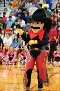 Cowboy Carl leads a skit to pump up the student body at the Rockwall pep rally on  Sept. 13, 2013.