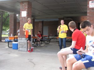 Juniors Clint Blackwell and Jessie Cranmer present awards to the fastest runners at the Run for Life 5K on May 17.