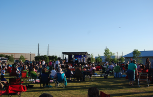 Coppell citizens of all ages gather at town square in Old Town Coppell to celebrate its grand new opening with a live concert and food on May 3. Photo by Summer Crawford. 