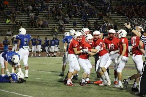 Tight end Scott Huntsman celebrates with his teammates after Coppell scores a touchdown in the second half of the first football game against the Hebron Hawks. Photo by Aubrie Sisk