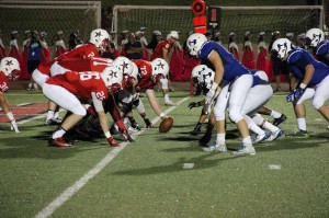 The Coppell offensive line stands at the ready and focuses in on the game prior to the snap during the first football game of the season versus the Hebron Hawks. Coppell goes on to win the game 52-30. Photo by Aubrie Sisk