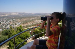 Coppell Middle School North eighth grader David Trakhtengerts sits on a friend's balcony overlooking the city of Ariel in Israel. Photo courtesy of Natasha Livshits. 
