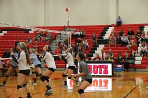 Coppell High School’s Junior Varsity Volleyball players Jessica James, Breanne Chausse, Abbie Klassen and Sabrina Boccalandro prepare to return the ball back to LD Bell on Friday night.  