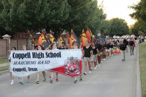 This year's homecoming parade commenced tonight with the arrival of the Coppell High School Marching Band and Color Guard. The parade was apart of one of the many activities to get in the mood for this weekend's celebration of homecoming. Photo by Mallorie Munoz. 
