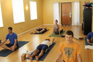 Yoga class attendees breathe and stretch before morning class on Oct. 25. Photo by Stephanie Alexander.
