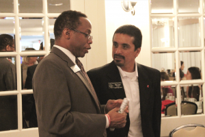 Coppell Board of Trustees member Anthony Hill discussing the presentation with Coppell High School Principal Mike Jasso. Photo by Christianna Haas. 