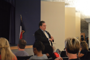 Calvin Bond presents to the parents of Coppell students about many different aspects of drugs among teenagers on October 28, 2014, in the Coppell Middle School West auditorium. Photo by Amanda Hair. 