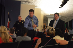 Brad Hunt (left) and Calvin Bond (right) educate the parents of Coppell students about many different aspects of drugs among teenagers on Oct. 28, 2014 in the Coppell Middle School West auditorium. Photo by Amanda Hair. 